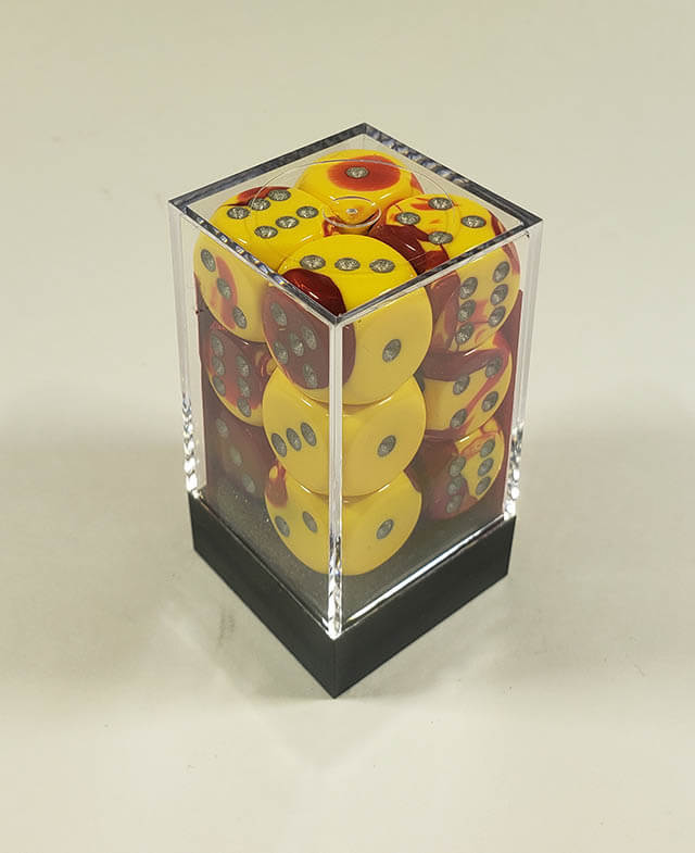 A close up of the Chessex Gemini Red and Yellow 16mm d6 dice set in its package.