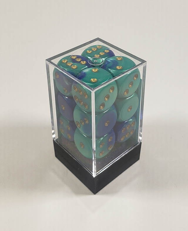 A close up of the Chessex Gemini Blue and Teal 16mm d6 dice set in its package.