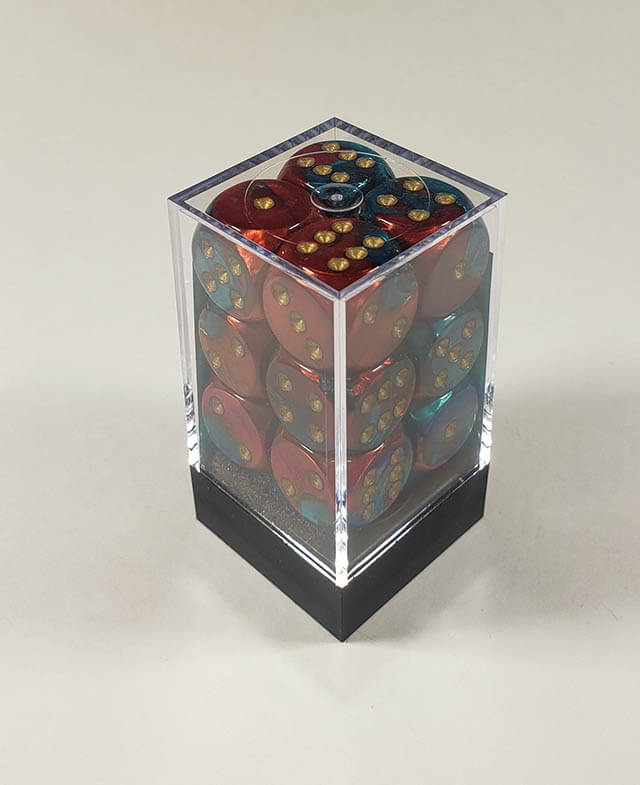 A close up of the Chessex Gemini Red and Teal 16mm d6 dice set in its package.