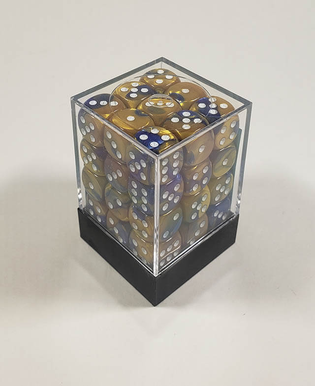 A close up of the Chessex Gemini Blue and Gold 12mm d6 dice set in its package.