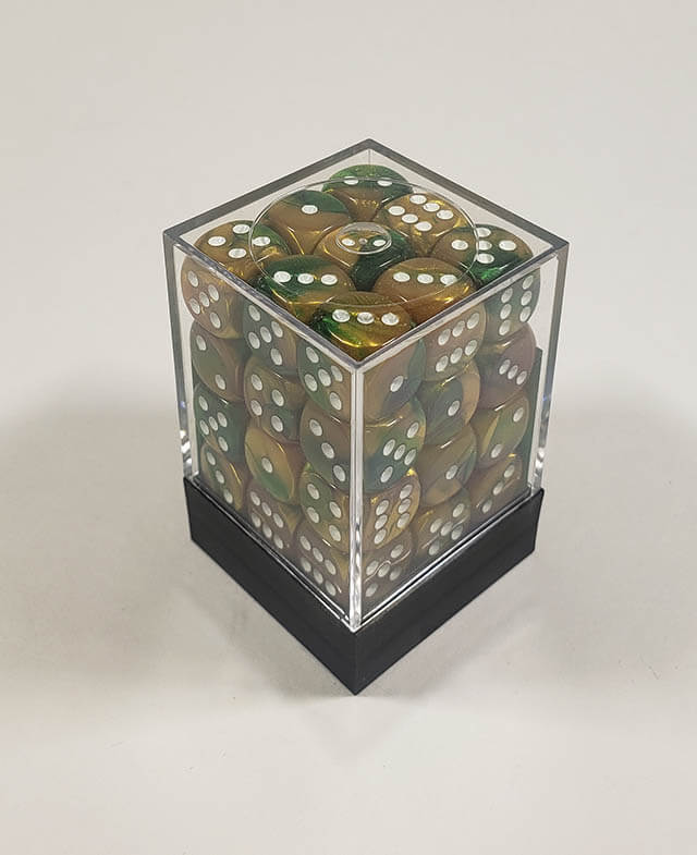 A close up of the Chessex Gemini Gold and Green 12mm d6 dice set in its package.
