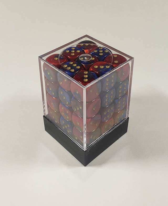 A close up of the Chessex Gemini Blue and Red 12mm d6 dice set in its package.