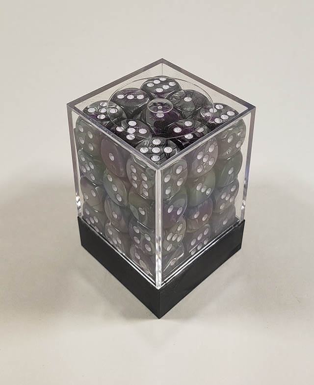 A close up of the Chessex Gemini Purple and Steel 12mm d6 dice set in its package.