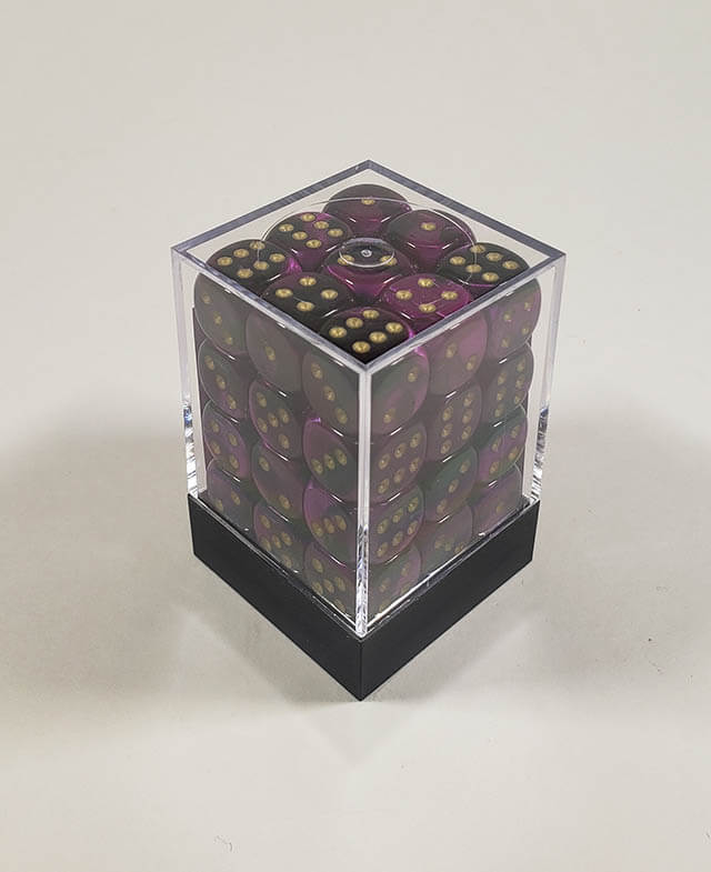 A close up of the Chessex Gemini Black and Purple 12mm d6 dice set in its package.