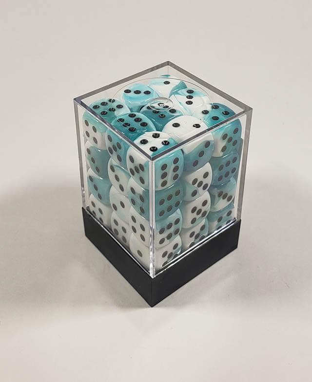 A close up of the Chessex Gemini Teal and White 12mm d6 dice set in its package.