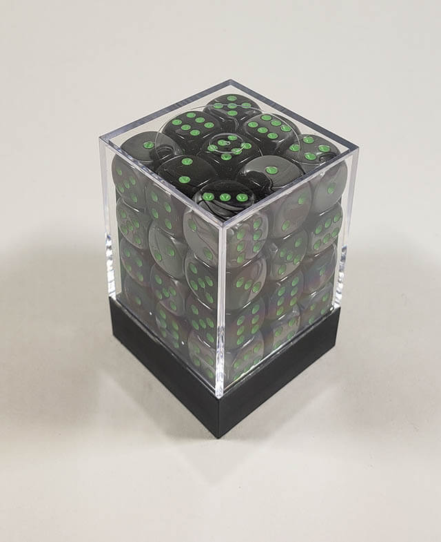 A close up of the Chessex Gemini Black and Grey 12mm d6 dice set in its package.