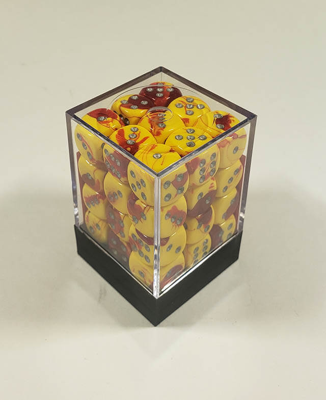 A close up of the Chessex Gemini Red and Yellow 12mm d6 dice set in its package.