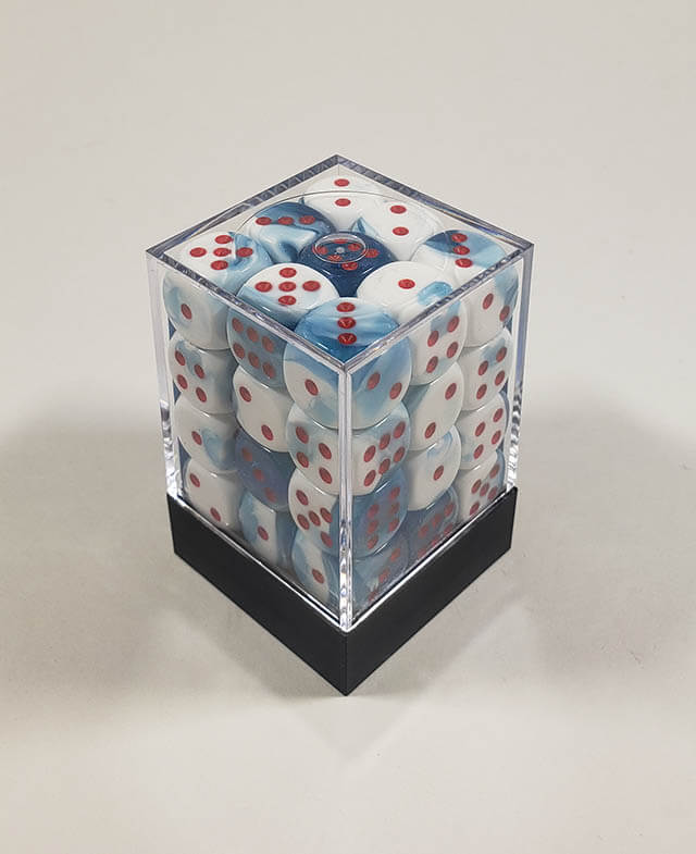 A close up of the Chessex Gemini Astral Blue White 12mm d6 dice set in its package.