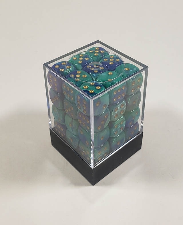 A close up of the Chessex Gemini Blue and Teal 12mm d6 dice set in its package.