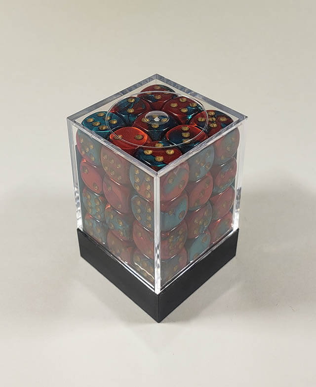 A close up of the Chessex Gemini Red and Teal 12mm d6 dice set in its package.