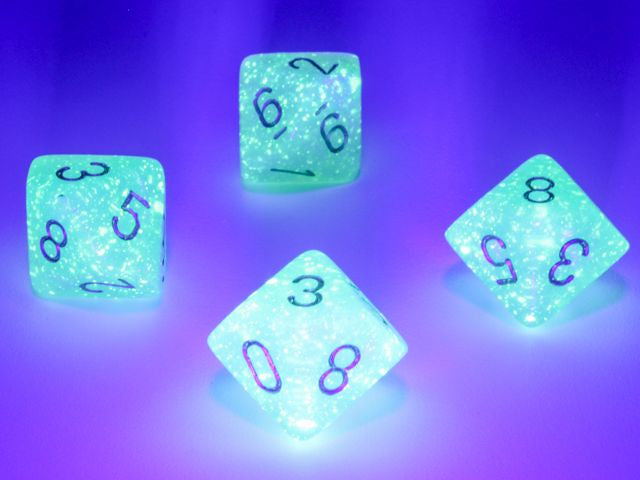 A close up of examples from the Chessex Borealis Light Green with gold 10 d10 dice set under a blacklight.