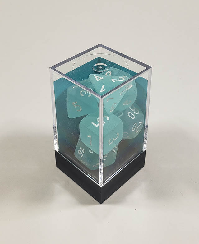 A close up of the Chessex Frosted Teal polyhedral dice set in its package.