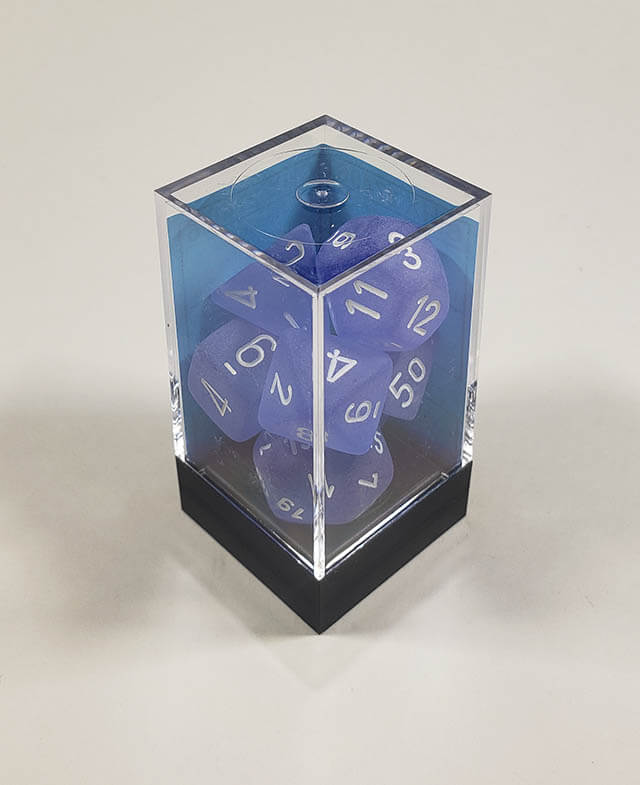 A close up of the Chessex Frosted Blue polyhedral dice set in its package.