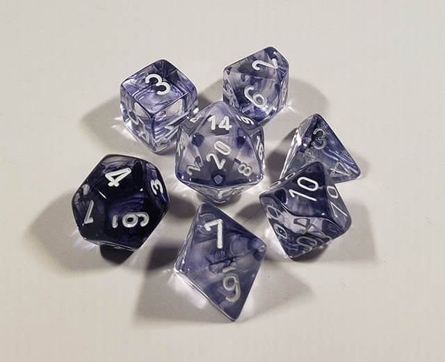 A close up of the Chessex Nebula Black polyhedral dice set.