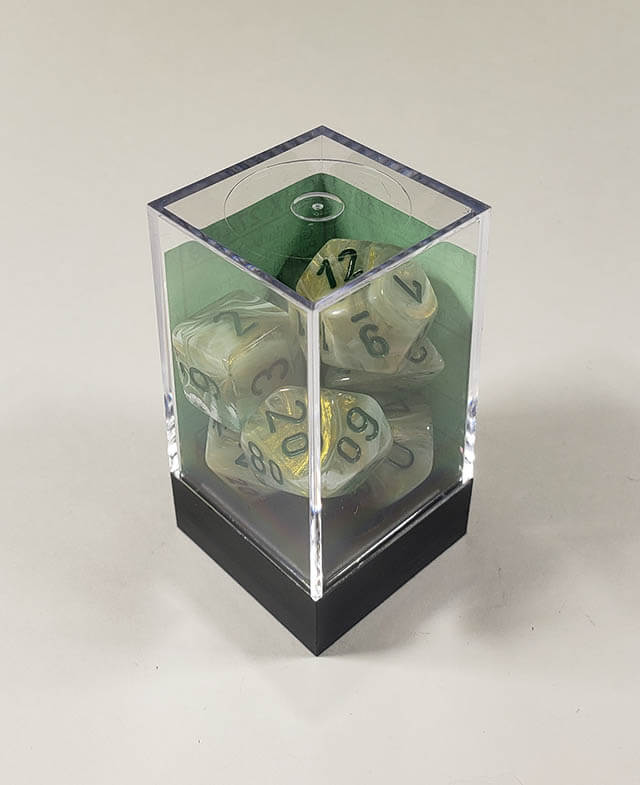 A close up of the Chessex Marble Dark Green polyhedral dice set in its package.
