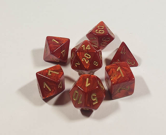 A close up of the Chessex Scarab Scarlet polyhedral dice set.