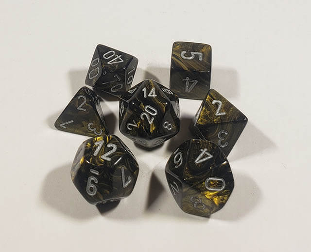 A close up of the Chessex Leaf Black polyhedral dice set.