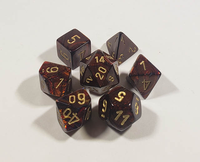 A close up of the Chessex Scarab Blue Blood polyhedral dice set.