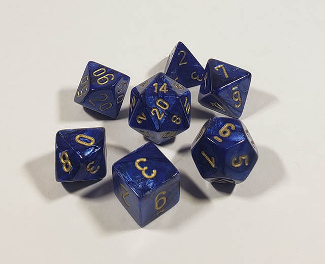 A close up of the Chessex Scarab Scarlet polyhedral dice set.
