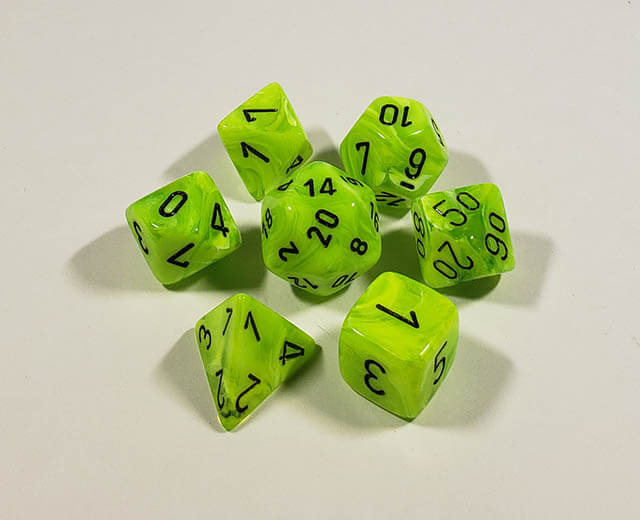 A close up of the Chessex Vortex Bright Yellow with black polyhedral dice se