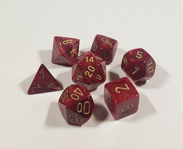 A close up of the Chessex Vortex Burgundy with gold polyhedral dice set 