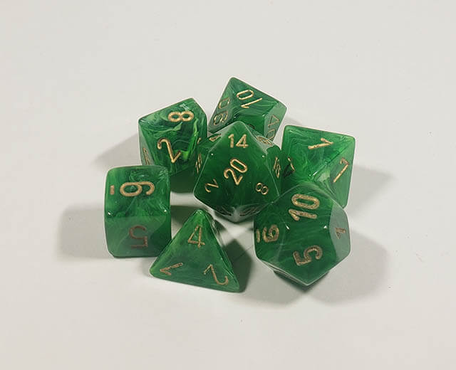 A close up of the Chessex Vortex Green with Gold polyhedral set.