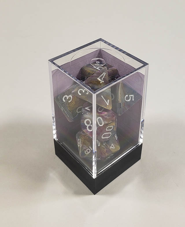 A close up of the Chessex Festive Carousel polyhedral dice set in its package.