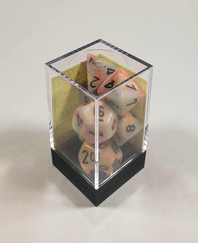 A close up of the Chessex Festive Circus  polyhedral dice set in its package.