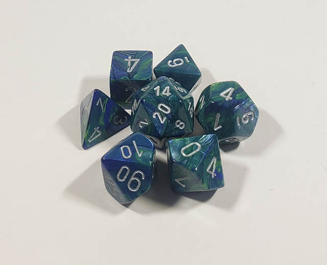 A close up of the Chessex Festive Green polyhedral dice set.