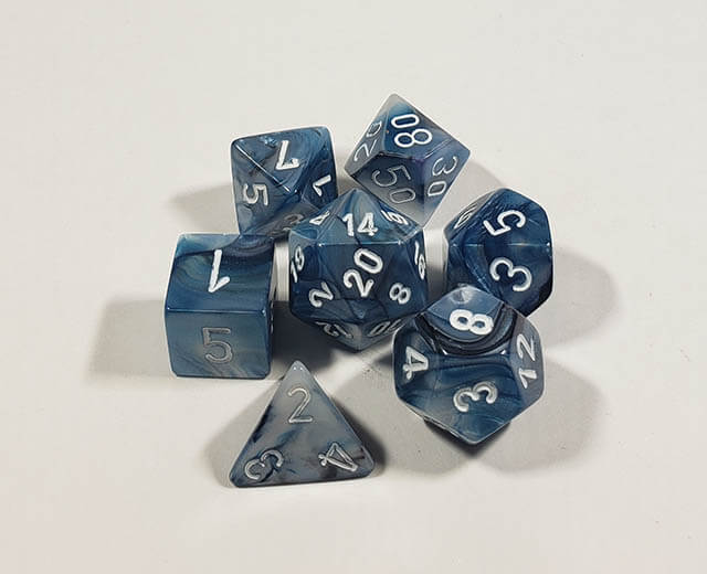 A close up of the Chessex Lustrous Slate polyhedral dice set.