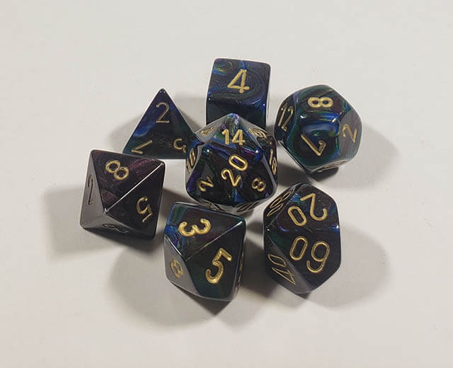 A close up of the Chessex Lustrous Shadow polyhedral dice set.