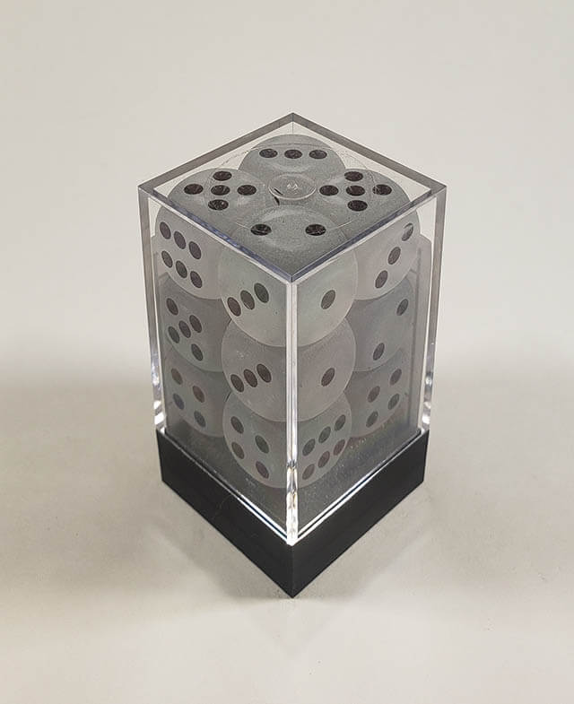 A close up of the Chessex Frosted Clear 16mm d6 dice set in its package.