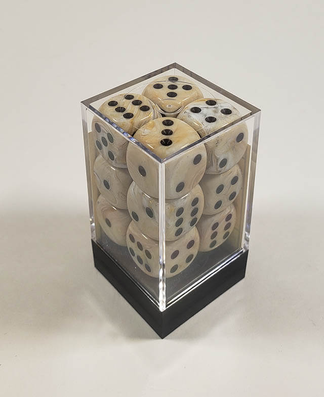 A close up of the Chessex Marble Ivory 16mm d6 dice set in its package.