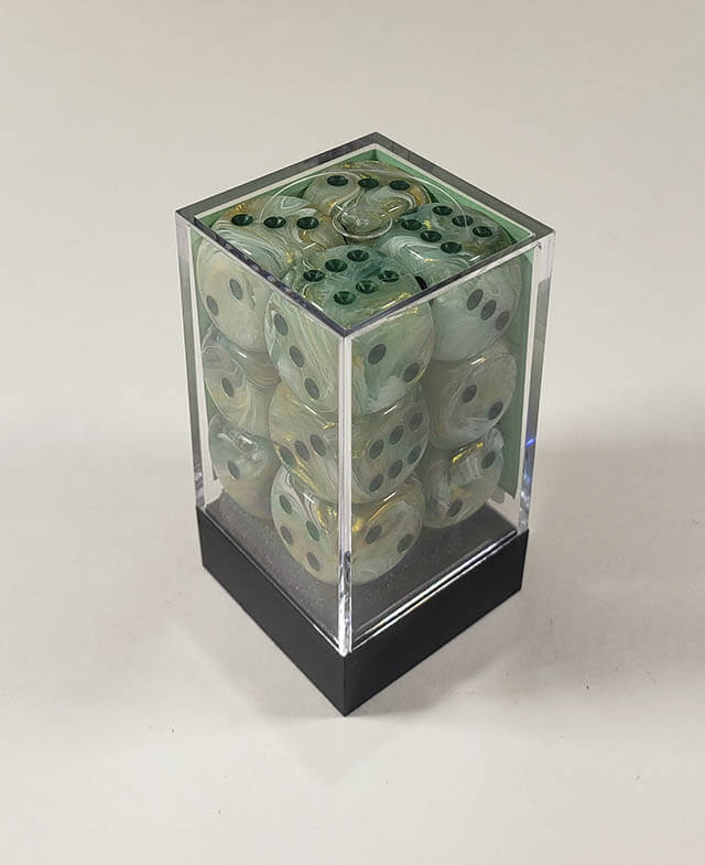 A close up of the Chessex Marble Dark Green 16mm d6 dice set in its package.