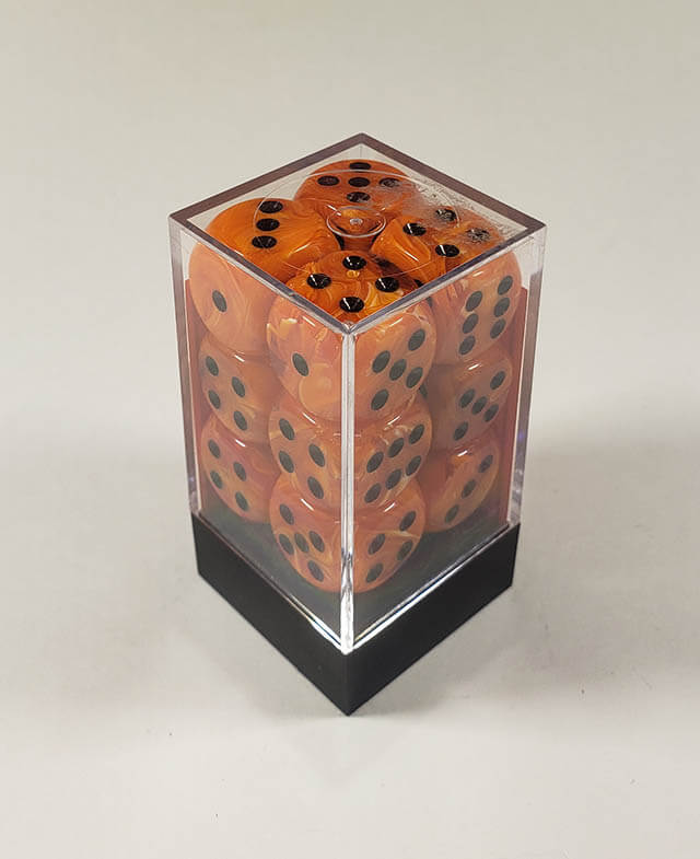 A close up of the Chessex Vortex Orange with Black 16mm d6 dice set in its package.