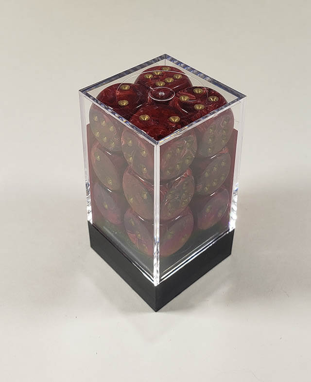A close up of the Chessex Vortex Burgundy with gold 16mm d6 dice set in its package.