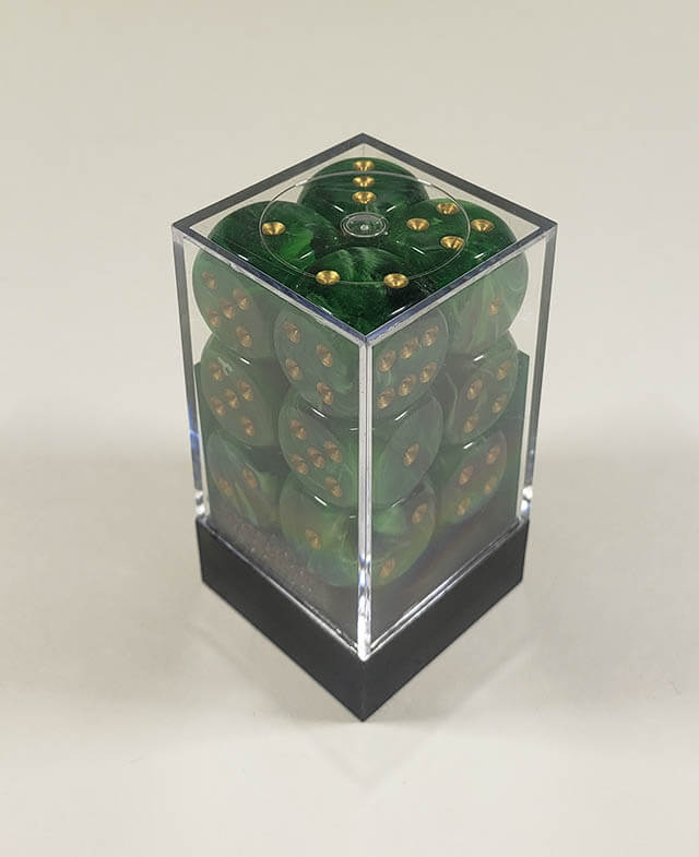 A close up of the Chessex Vortex green with gold 16mm d6 set in its package,