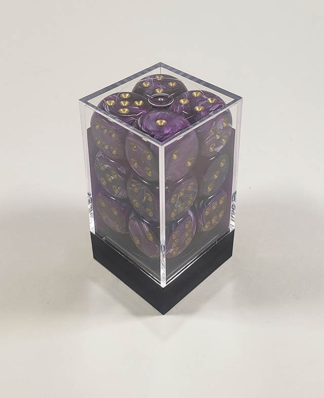 A close up of the Chessex Vortex  Purple with Gold 16mm d6 die set in its package.