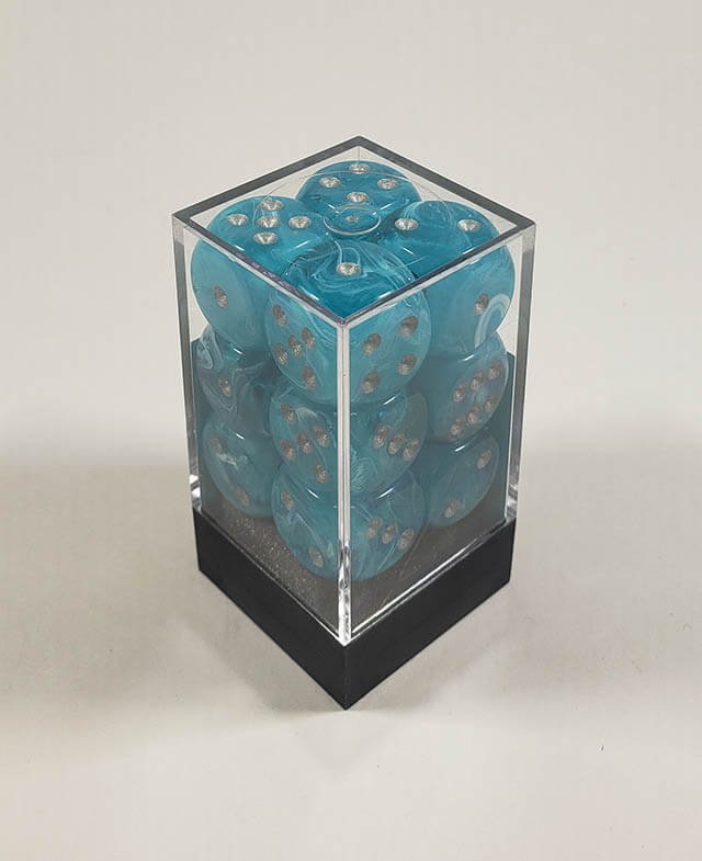 A close up of the Chessex Cirrus Aqua 16mm d6 dice set in its package.