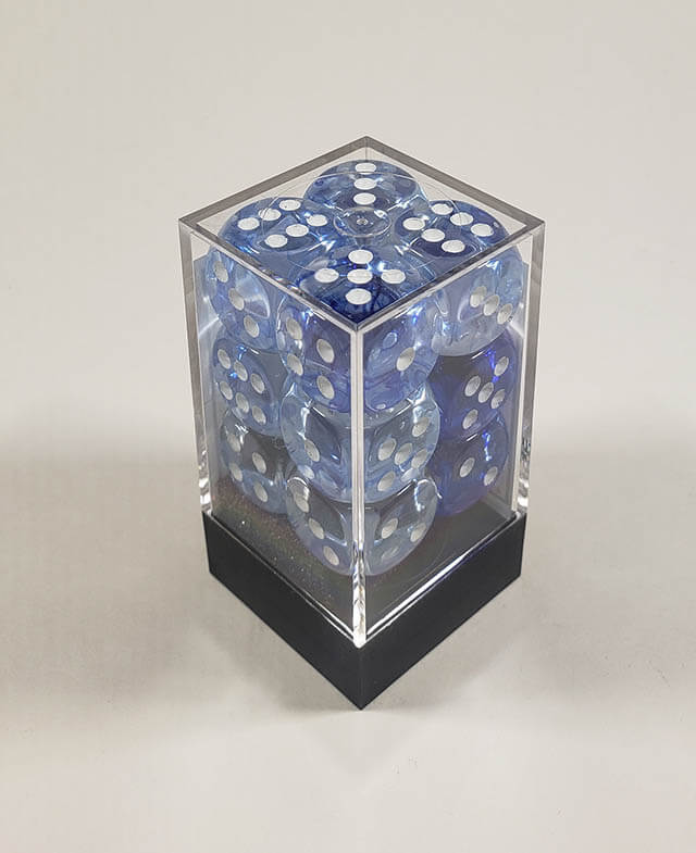 A close up of the Chessex Nebula Dark Blue 16mm d6 dice set in its package.