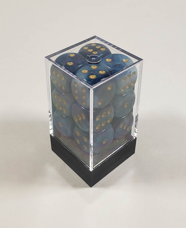 A close up of the Chessex Phantom Teal  16mm d6 dice set in its package.