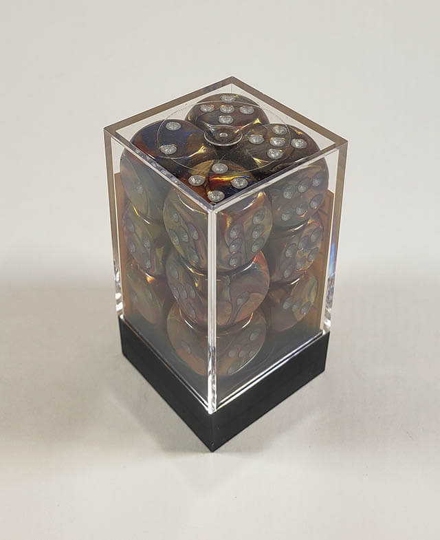 A close up of the Chessex Lustrous Gold 16mm d6 dice set in its package.