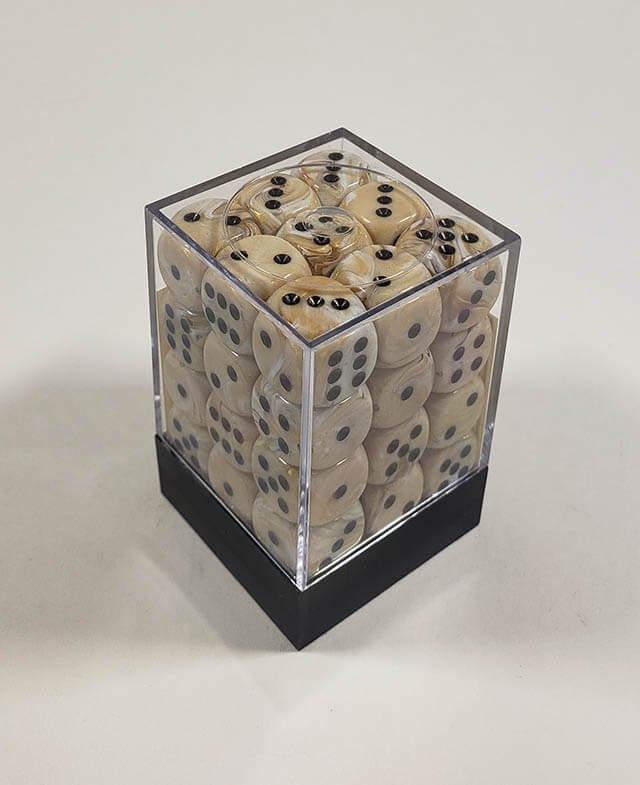 A close up of the Chessex Marble Ivory 12mm d6 dice set in its package.