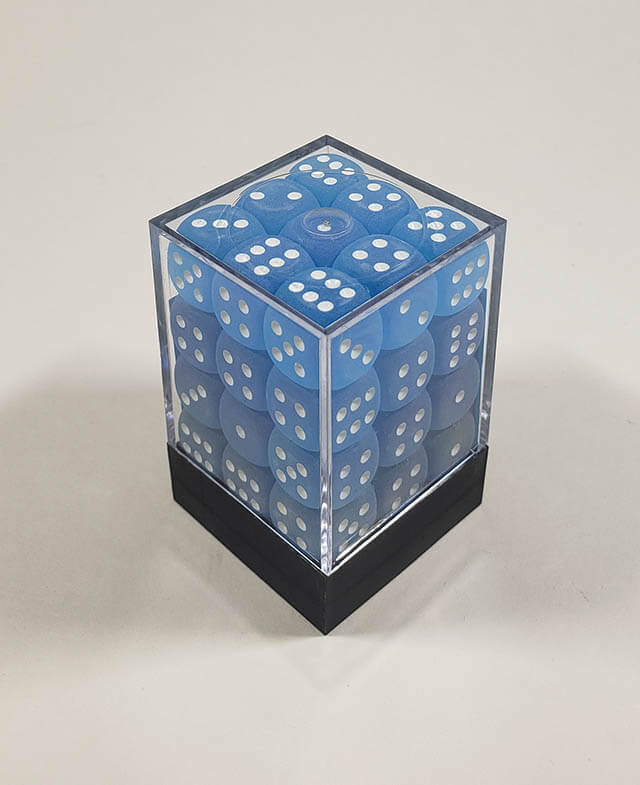 A close up of the Chessex Frosted Carribean Blue 12mm d6 dice set in its package.
