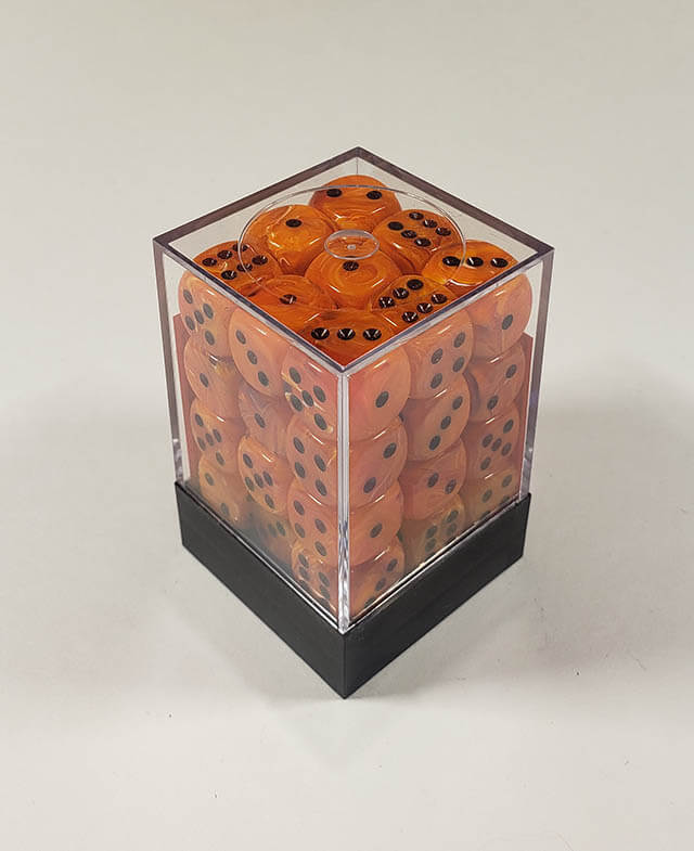 A close up of the Chessex Vortex Orange with Black 12 mm d6 dice set in its package.