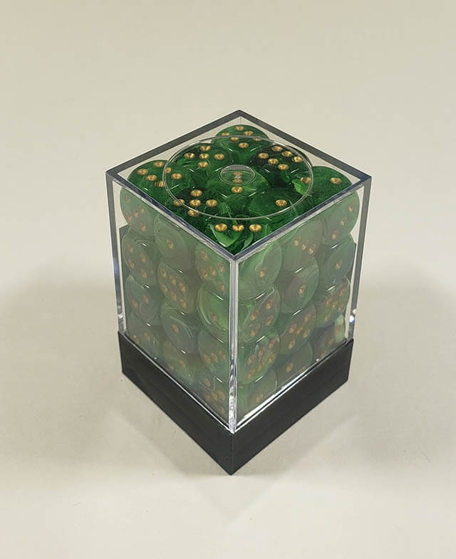 A close up of the Chessex Vortex Green with gold 12mm d6 dice set in its package.