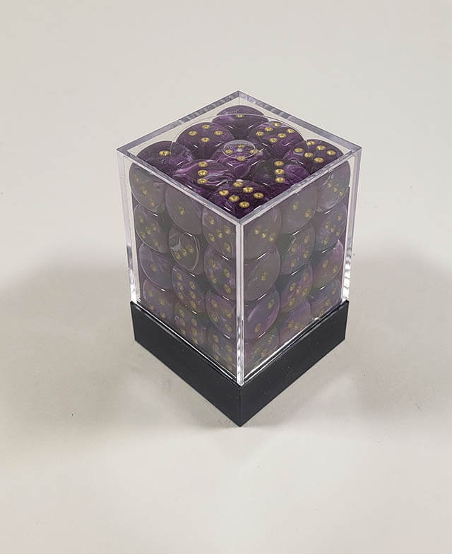 A close up of the Vortex Purple with gold 12mm d6 dice set in its package.