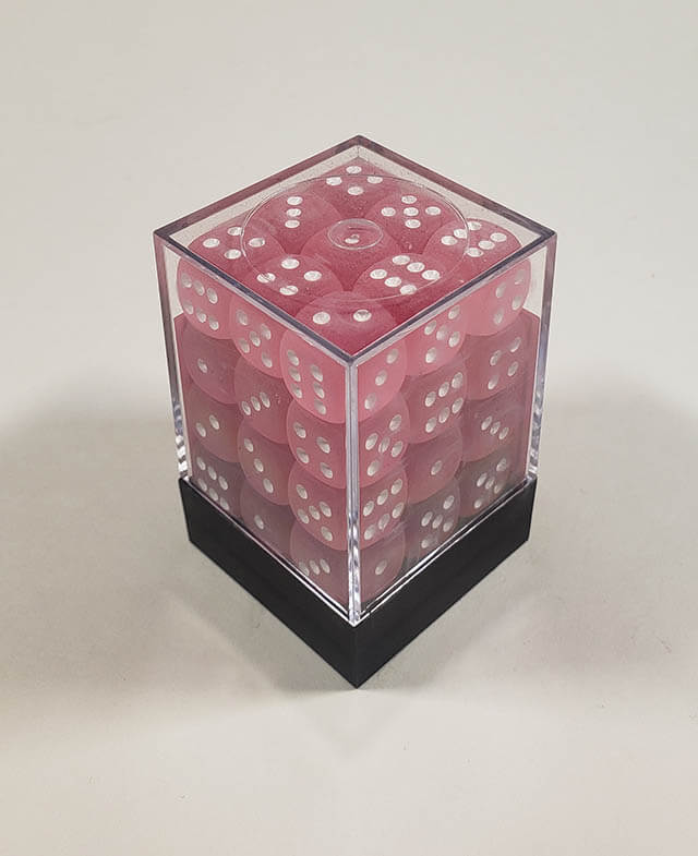 A close up of the Chessex Frosted Pink 12mm d6 dice set in its package.