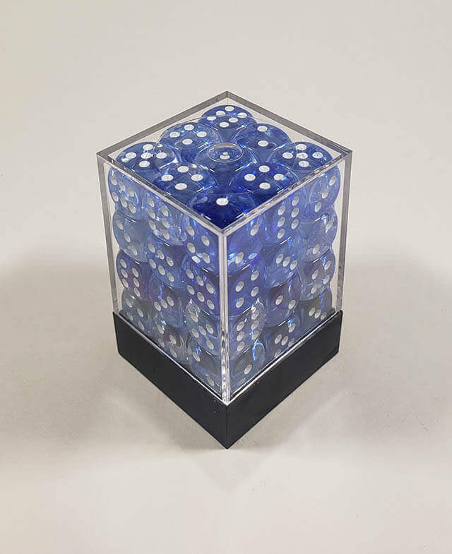 A close up of the Chessex Nebula Dark Blue 12mm d6 dice set in its package.