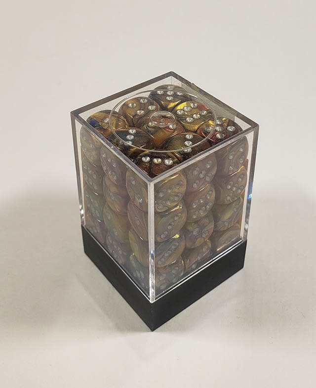 A close up of the Chessex Lustrous Gold 12mm d6 dice set in its package.